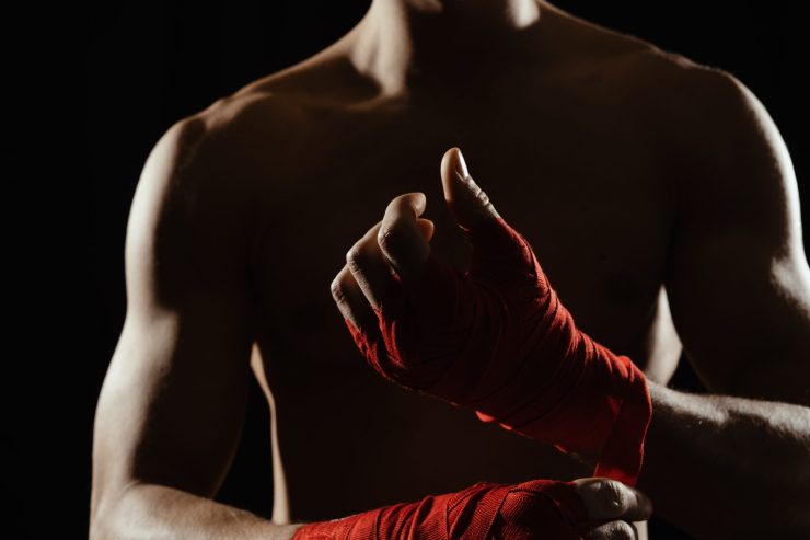 Stack of essential boxing books featuring legendary fighters and the history of the sport.